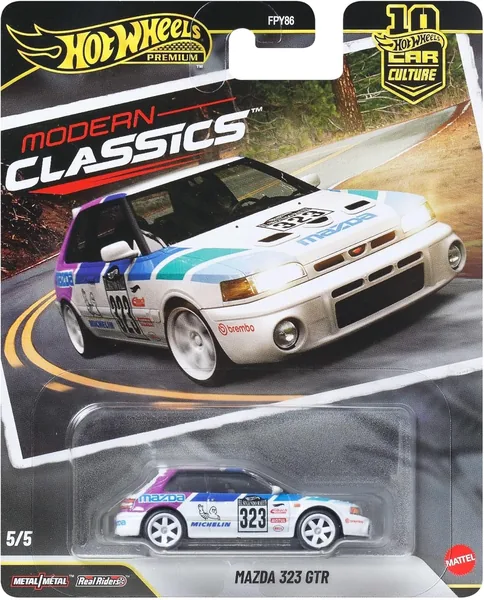 Hot Wheels Mazda 323 GTR 1:64 Escala Premium Coche Juguete con Neumáticos Real Riders y Chasis de Metal, JKF17 - Ahorra un 18%