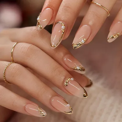 Almond Nude French Tips Nails with Gold & Pearl Accents